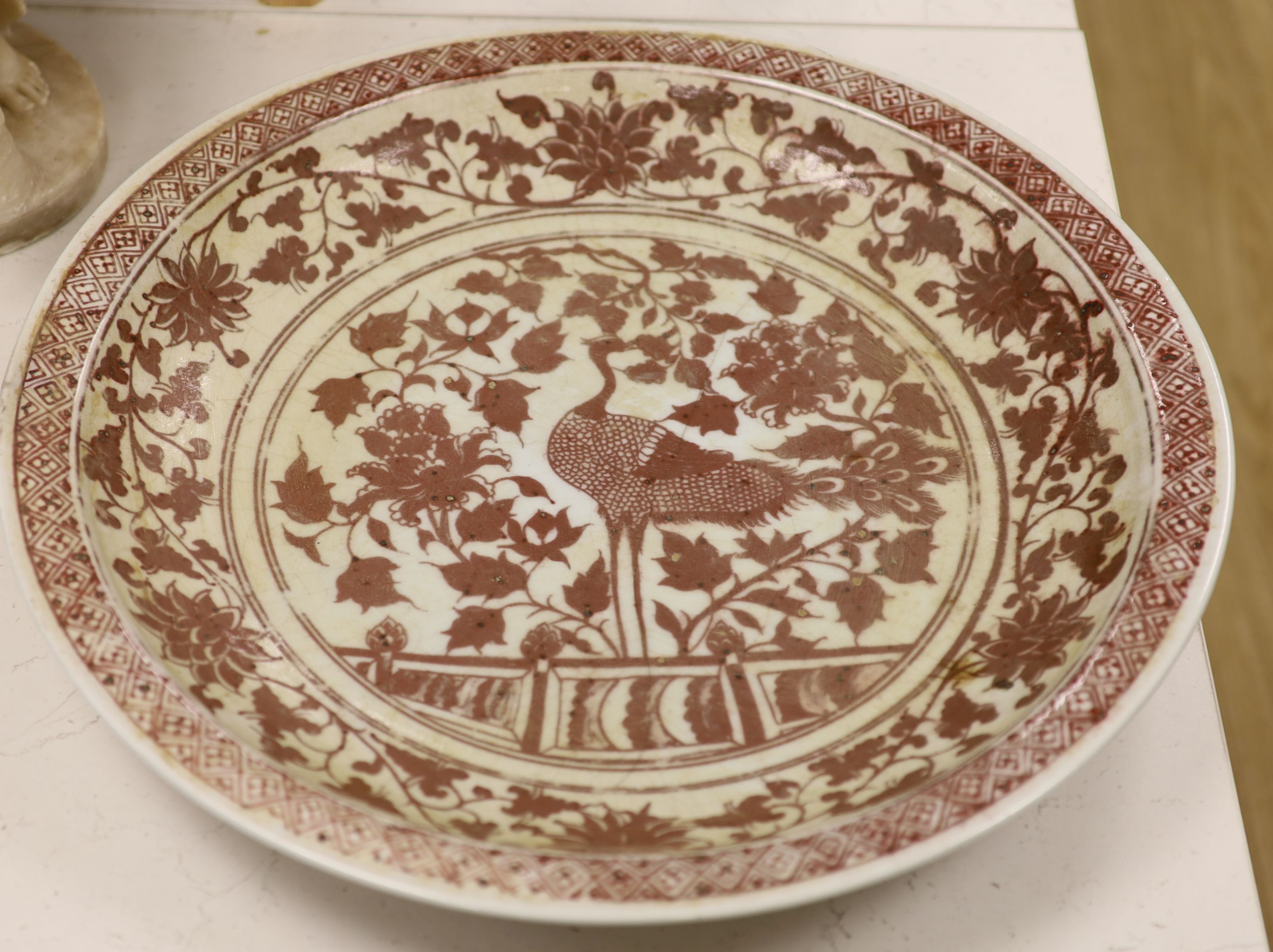 A large Chinese underglaze copper red charger, diameter 53cm